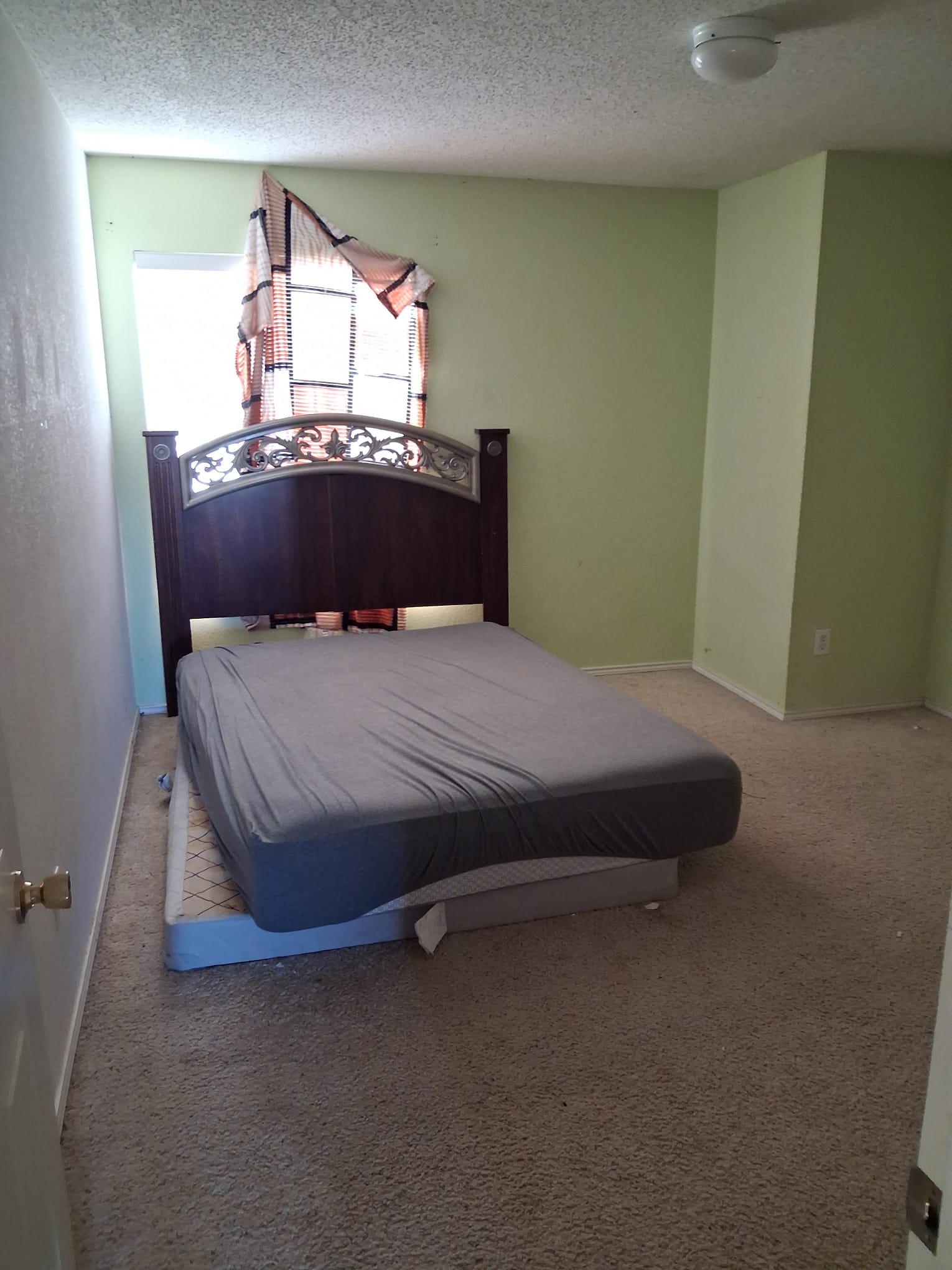 Bedroom with a bed before the clearout